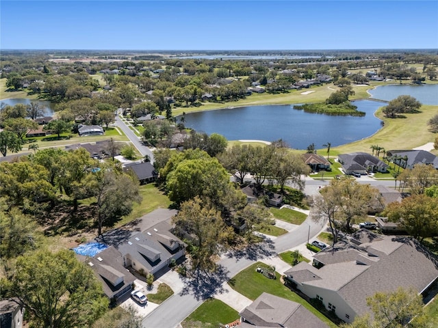 bird's eye view with a water view and a residential view