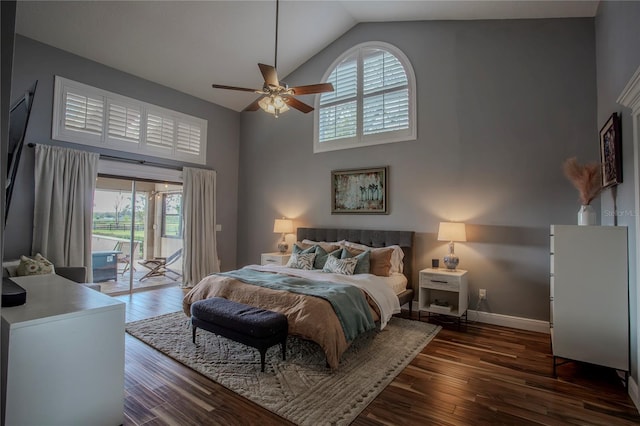 bedroom featuring access to exterior, baseboards, ceiling fan, dark wood finished floors, and high vaulted ceiling