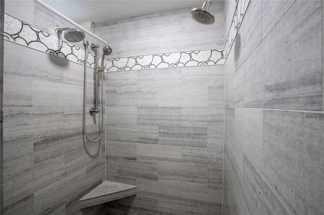 full bath with a tile shower