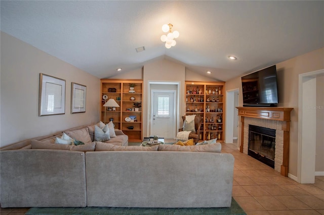 unfurnished living room with visible vents, built in features, light tile patterned flooring, a fireplace, and vaulted ceiling