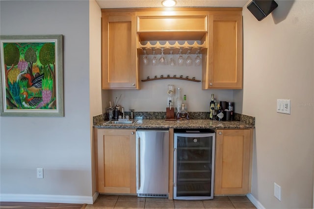 bar featuring refrigerator, light tile patterned flooring, a sink, indoor wet bar, and wine cooler