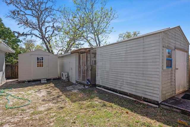 view of shed featuring fence