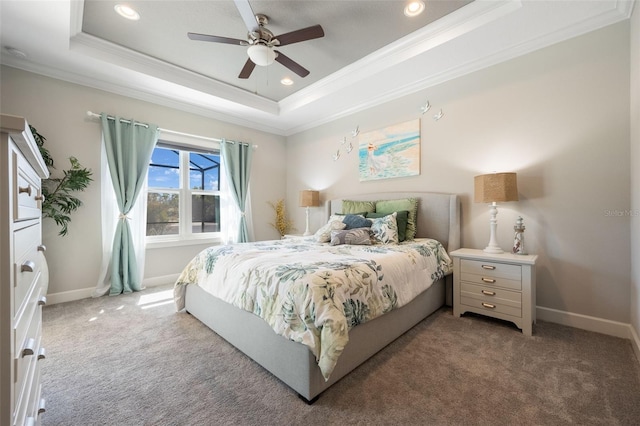 carpeted bedroom with ornamental molding, a tray ceiling, baseboards, and recessed lighting