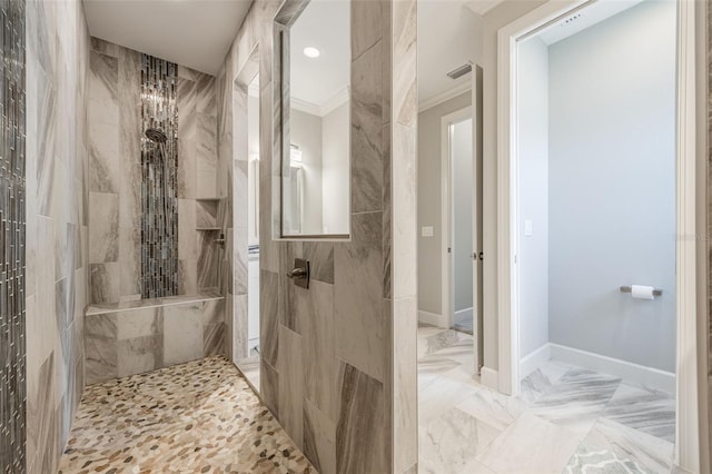 full bath with visible vents, baseboards, ornamental molding, marble finish floor, and a walk in shower