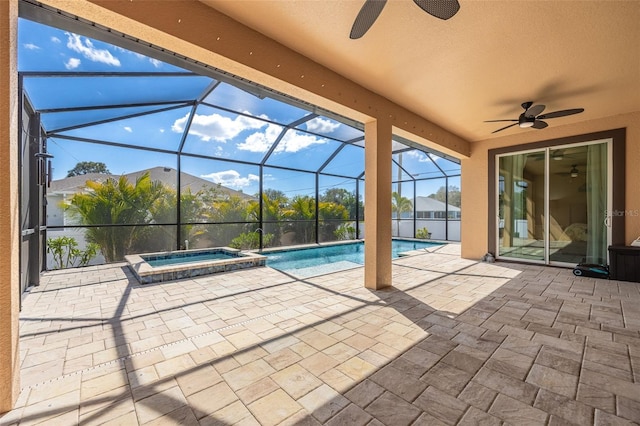 view of swimming pool with a lanai, a patio area, a pool with connected hot tub, and ceiling fan