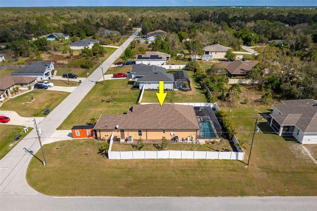 birds eye view of property with a forest view and a residential view