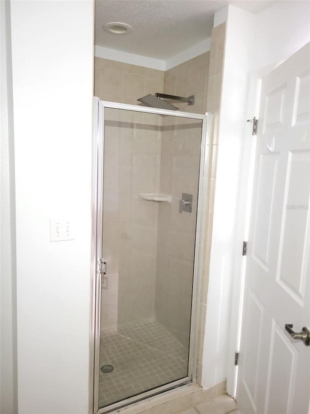 full bathroom featuring a shower stall