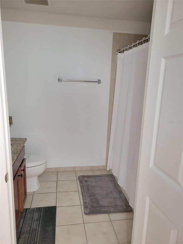 full bath featuring vanity, toilet, a shower with curtain, and tile patterned flooring