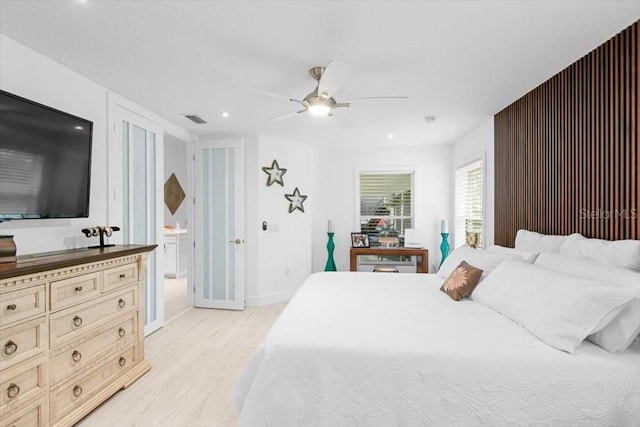 bedroom featuring recessed lighting, visible vents, light wood-style flooring, a ceiling fan, and baseboards