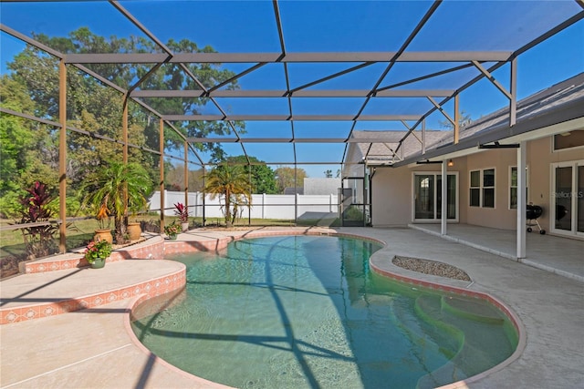 view of pool featuring a lanai, a fenced in pool, a patio, and a fenced backyard