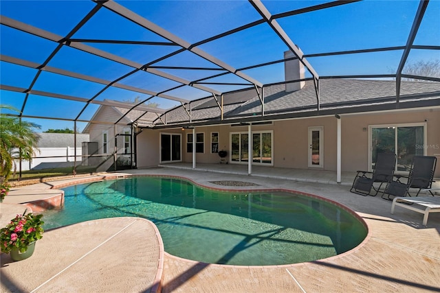 view of pool featuring a lanai, a patio area, and ceiling fan