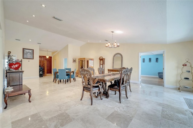 dining room featuring a chandelier, lofted ceiling, recessed lighting, visible vents, and baseboards