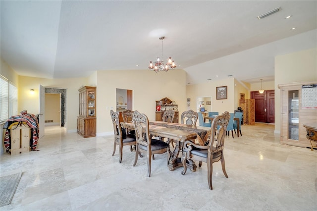 dining room with a notable chandelier, visible vents, baseboards, vaulted ceiling, and marble finish floor