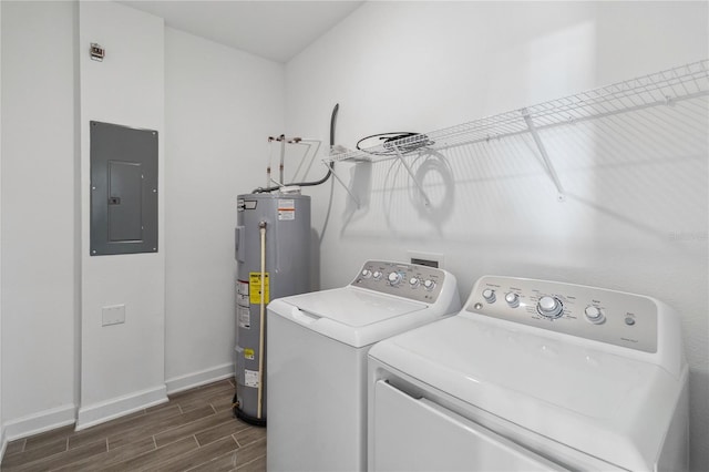 laundry area with wood tiled floor, laundry area, electric panel, electric water heater, and independent washer and dryer