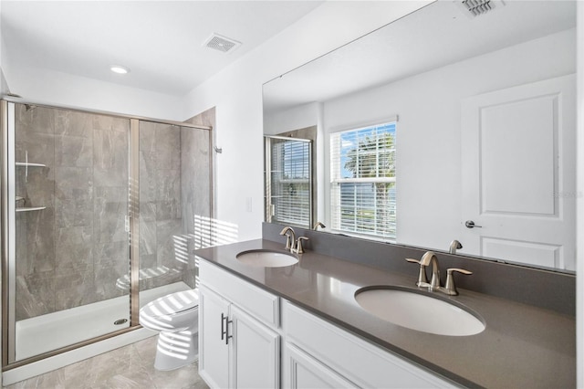 full bathroom with visible vents, toilet, and a sink