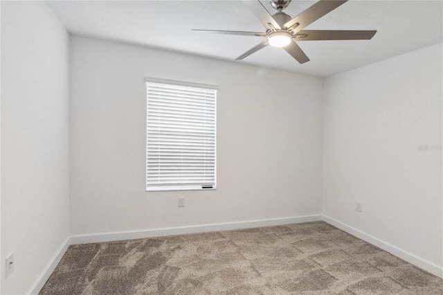 unfurnished room with baseboards, ceiling fan, and carpet floors