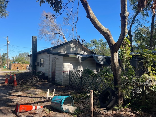 view of side of property with fence