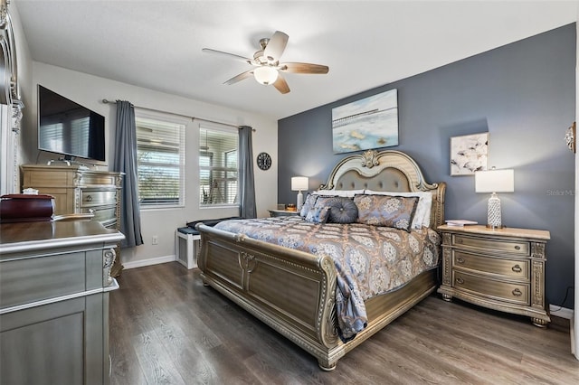 bedroom featuring baseboards, dark wood-type flooring, and a ceiling fan