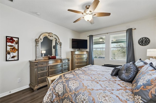 bedroom featuring a ceiling fan, baseboards, and dark wood-style flooring