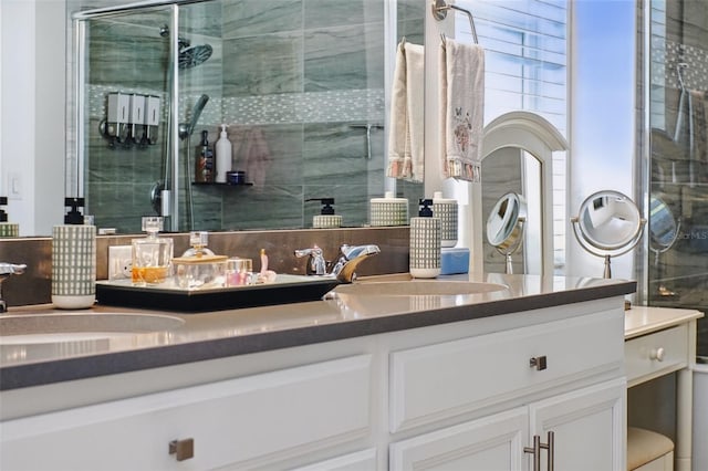 full bath with vanity and a tile shower