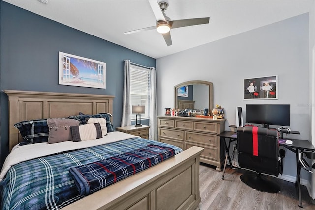 bedroom with light wood-style floors and ceiling fan