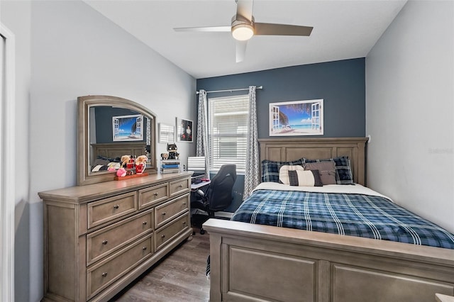 bedroom with wood finished floors and a ceiling fan