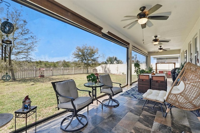 view of patio / terrace featuring ceiling fan, outdoor lounge area, and a fenced backyard