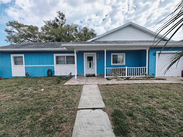 view of front of home featuring a garage, a porch, and a front yard