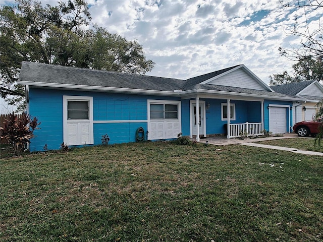 single story home featuring a porch, a front yard, concrete block siding, and an attached garage