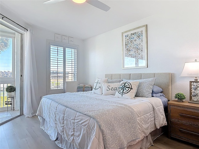 bedroom with access to exterior, a ceiling fan, and light wood-type flooring