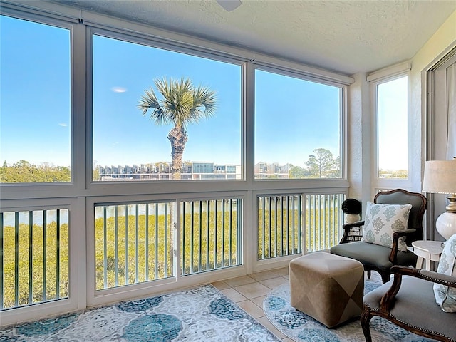 sunroom featuring a city view