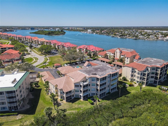 birds eye view of property with a residential view and a water view