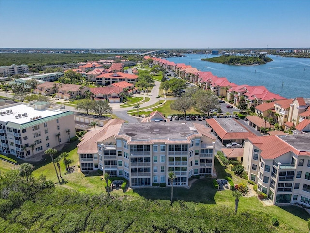 bird's eye view featuring a residential view and a water view