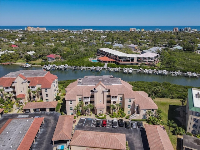 birds eye view of property featuring a water view