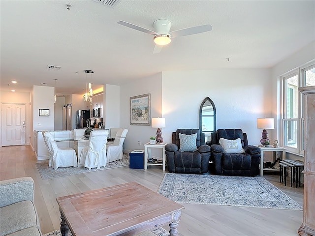 434 Bouchelle Dr Unit 202, New Smyrna Beach, FL 32169 - living area featuring light wood-style floors and ceiling fan