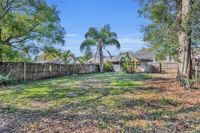 view of yard with a fenced backyard