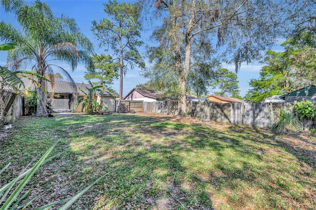 view of yard with a fenced backyard