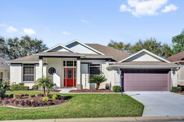 single story home featuring concrete driveway, a front lawn, a garage, and stucco siding