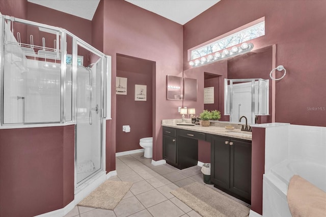 bathroom with double vanity, a sink, tile patterned flooring, a shower stall, and a bath