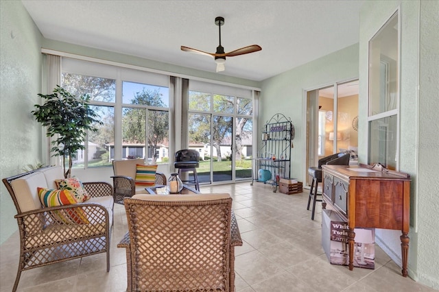 sunroom with a ceiling fan