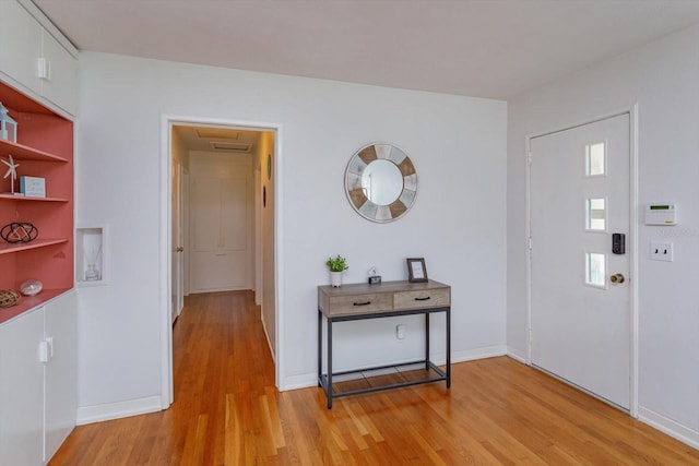 entrance foyer with light wood finished floors and baseboards