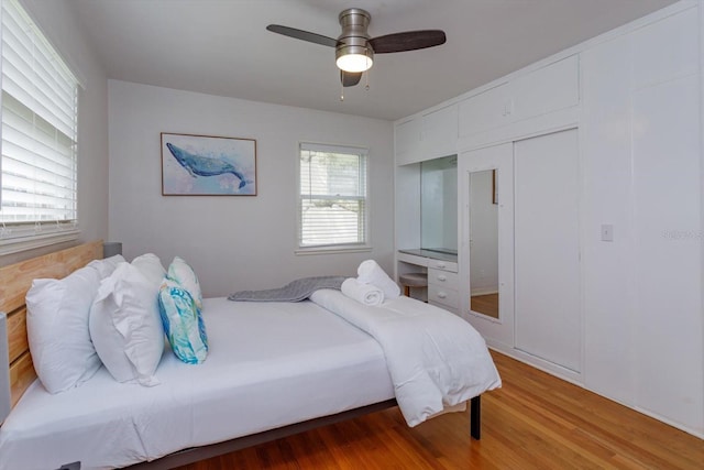 bedroom featuring ceiling fan and wood finished floors