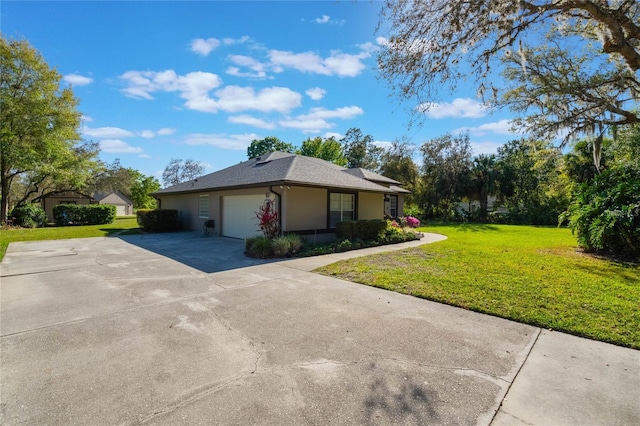 view of side of property featuring stucco siding, a lawn, driveway, a shingled roof, and a garage