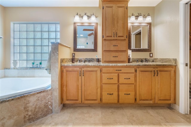 bathroom featuring a sink, a garden tub, double vanity, and tile patterned flooring