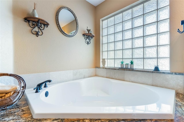 bathroom featuring a bath