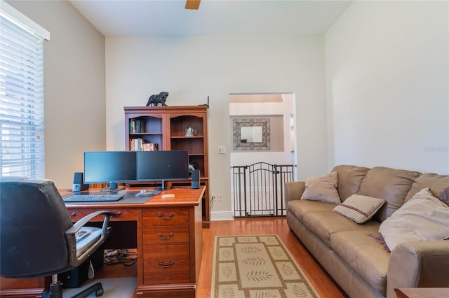 office space featuring ceiling fan and light wood-style flooring