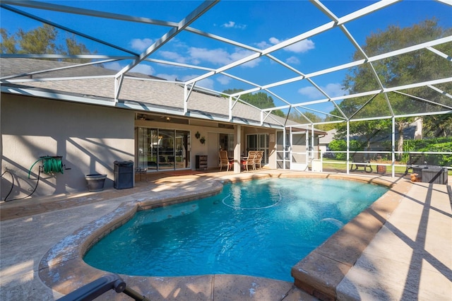 pool featuring a lanai and a patio