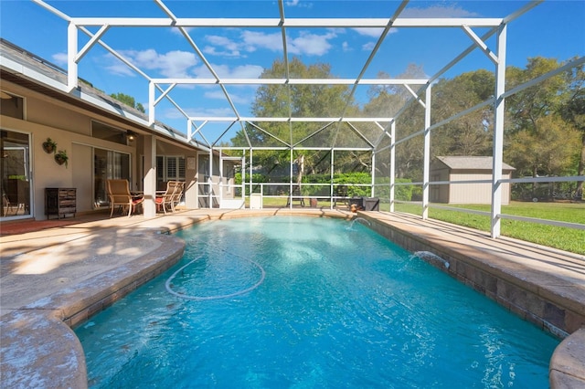 pool featuring a patio, a storage unit, an outdoor structure, and a lanai