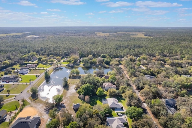 bird's eye view with a view of trees and a water view