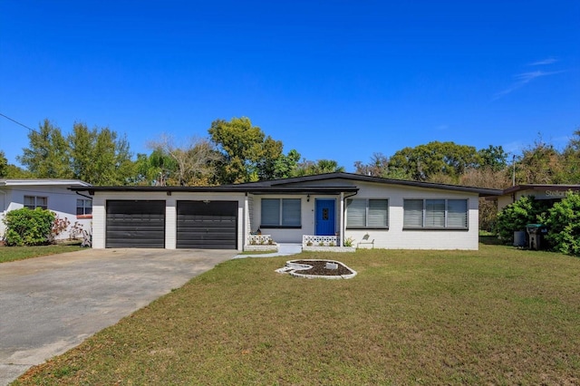 ranch-style house with a front yard, an attached garage, and driveway